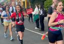 Sadie Stephenson waving to supporters during the Manchester Marathon