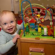 Working parents of children older than nine months can now apply for funded childcare starting from September this year. Pictured is Harry Thompson at a nursery in North Yorkshire