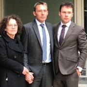 Derek Martindale, centre, with his wife Margaret and son John outside Fleetbank House in central London for the Infected Blood Inquiry in 2019