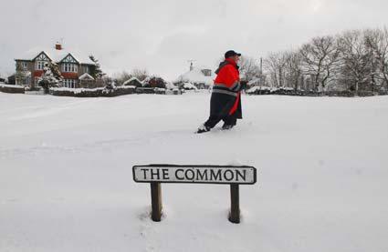 Postman David Pottas trudges through deep snow to get to homes in Goathland.
