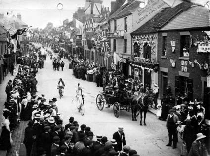 A procession moves down Wheegate, Malton, as the town celebrates the coronation of King George V in 1910.
