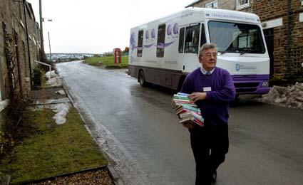 Barrie Pickering of North Yorkshire County Council's mobile library service delivers books to Hill Cottages, near Blakey Ridge, on the North York Moors.