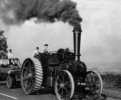 Jack Hardy, his daughter Kathleen and son Steven, of Ulleskelf, steaming along the Malton Road on their way to the third annual Pickering Traction Engine Rally in 1964.