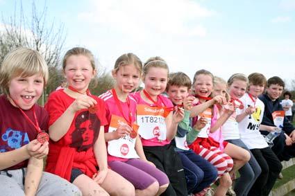 Children, aged between six and ten, all from Leavening, near Malton,    proudly show off their Sport Relief Mile medals after they all ran three miles at Rawcliffe Bar Country Park.