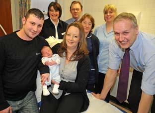 James Gardner and Alison Wright with baby Billy-James who was born at Pickering Surgery. From left are receptionist Nicola Scott, practice manager John Fletcher, practice nurse Ria 
Flinton, health care assistant Helen Smith and Dr Jim Coppack. 

