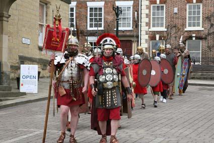 Soldiers march through the streets of Malton during the town's first Roman festival.