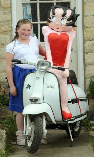 Sophie Reeves with her Betty Boop scarecrow on the Slingsby scarecrow trail.