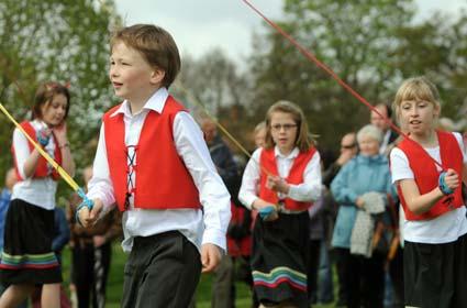 Children dance around the maypole in Sinnington.