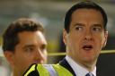 BELT TIGHTENING: Chancellor of the Exchequer George Osborne visits the production line at Bentley Motors in Crewe yesterday. But do job worries remain?