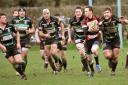 Malton & Norton’s Ian Cooke tries to run clear of a posse of York foes during his side’s 24-0 reverse at The Gannock