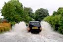A vehicle tackles the floods at Marton