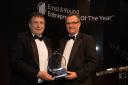 Stuart Paver, left, accepts the award at the Ernst & Young’s retail awards event
