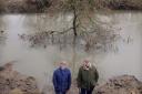 Mike Kitching, left, and Coun Tom Hemesley where the tree, now in the River Derwent, once stood.