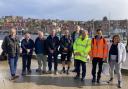 Councillors David Chance, Heather Phillips, Clive Pearson, Malcolm Taylor, Subash Sharma, Neil Swannick, Bryn Griffiths, George Jabbour and Heather Moorhouse at Whitby harbour