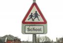 Parents have been urged to heed safety advice after cars were seen parking dangerously outside two primary school and one parent leaving their younger children in their vehicle while taking an older child to school..