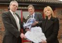 Simon Cox, left, receives the Malton Hospital petition from Dr Michael Lynch and Coun Lindsay Burr outside the Derwent Surgery in Malton