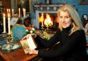 Selina Scott with the signed copy of the Dickens novel that suggests Malton provided an  inspiration for A Christmas Carol