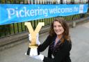 Emma Towning, from North Yorkshire County Council, with the Tour de Yorkshire trophy in Pickering