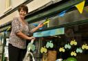 Pat Swift decorates her shop, Norton Aquaria, with Tour de Yorkshire buntingPicture: