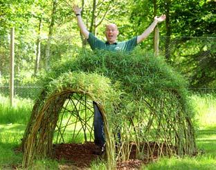  Scampston Hall gardener Phil Tatler pops his head out of the willow igloo in the new children’s playground. 

