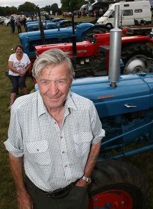 Ron Hughes, who owns a collection of 14 tractors, including this vintage Super Dextra Roadless which is worth over £20,000, at Malton Show. 