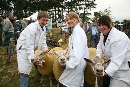 George Bulmer, with his sister Maisie, and Tina Dougherty, whose Sharolais sheep from the shamrock Flock at Kirbymisperton, won the group of three interbreed section at Malton Show.