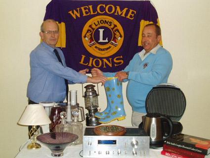 Lions club member Jerry Scarr, right, exchanges goods with Robin Rawson ahead of their Give And Take day on November 6.