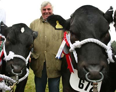 Andrew White, the breeder of Overall Champion in the commerical section, Lulu, right, and the Reserve Champion, Sharma, left at the Malton Show