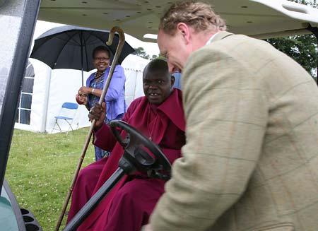 The Archbishop of York Jon Sentamu arrives at the Malton show to be driven around in a golf buggy by the Acting Chairman of the show, Charlie Breese