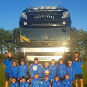 Heslerton Under-11s in their new raincoats sponsored by David Lyles Transport Ltd of Wakefield