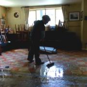 Dawn Shepherd cleans up at The Station, Pickering, after the floods