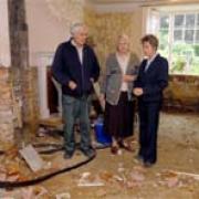 Vale of York MP Anne McIntosh (right) during her visit to flood-hit Pickering on Saturday talks to Peter and Mary Croot at their home in Beck Isle, Pickering, which was flooded and is now undergoing repairs