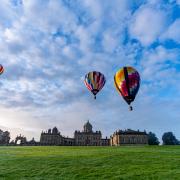 Balloons over Castle Howard during the Yorkshire Balloon Fiesta