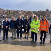 Councillors David Chance, Heather Phillips, Clive Pearson, Malcolm Taylor, Subash Sharma, Neil Swannick, Bryn Griffiths, George Jabbour and Heather Moorhouse at Whitby harbour