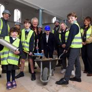 Children from Settrington All Saint’s Primary School bury the time capsule: Lily Allen, 8,; Harry Allen, 10; Digby Crockett, 10; and Mayor Councillor Ian Conlin, with Paul Emberley – Trustee and Wesley Centre Development Lead with Pinnacle