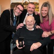 Eric is pictured with his medal and with, from left to right: the Mayor of Whitby, Bob Dalrymple, Martin Drake, Chairman of Scarborough RAF Association and Jubilee House Activities Co-ordinator Jakki Edmond, who applied for the medal on Eric’s