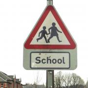 Parents have been urged to heed safety advice after cars were seen parking dangerously outside two primary school and one parent leaving their younger children in their vehicle while taking an older child to school..