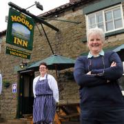 Janet Frank, right, with staff members Guy  Richardson and Dawn Burton outside The Moors Inn in Appleton-le-Moors which has re-opened but can’t sell alcohol until its new licence comes through