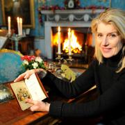 Selina Scott with the signed copy of the Dickens novel that suggests Malton provided an  inspiration for A Christmas Carol
