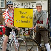 Authors Andy Seed, left, and Mike Barfield outside Northern Ride in Malton. The two are doing a tour around local primary schools ahead of the Tour de France