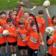 Pupils at Kirkbymoorside Primary School celebrate their recent success at hockey and tag rugby