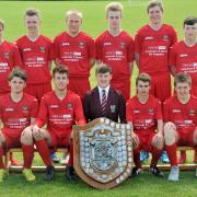 Norton College Year 11 football team with the trophy they won. Front, from left, Josh Ford, Harvey Townley, Bradley Freer, Baron Gregory and Jack Boyd. Back row, Connor Pickering, Robbie Butler, Nick Lock, Iain Kerr, Will Hughes and Josh Towse