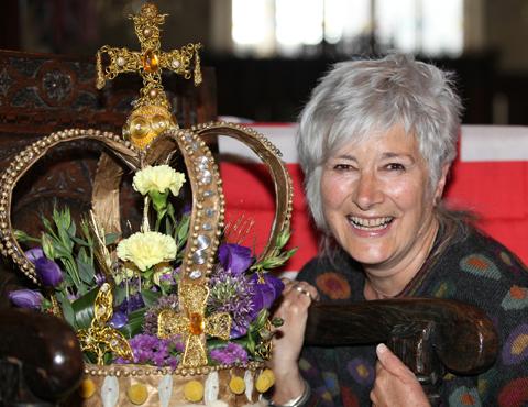 Gill Renshaw, the organiser of a Coronation Special exhibition in St Peters and St Pauls Church, Pickering, with a floral Crown made by Elaine Bedford, marking 60 years of the Queen's reign.