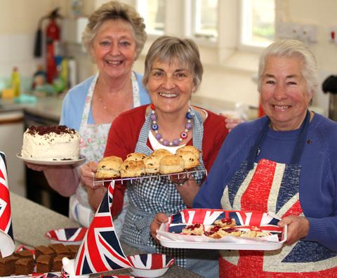 Carole Ellis, Victoria Bryant and Jennie Read getting ready to serve up Jubilee lunches for visitors to Pickering Parish Hall.