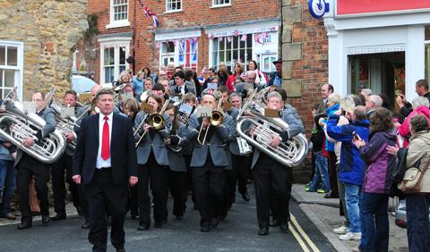 The Kirkbymoorside town brass band lead Kirkbymoorside Jubilee parade on Sunday