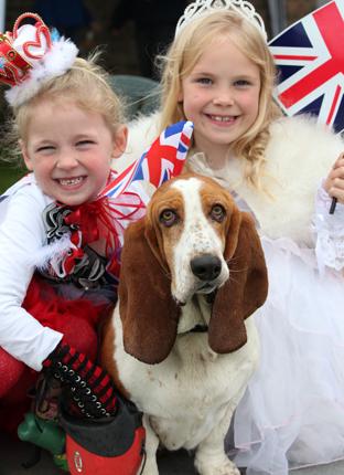 Evie and Layla dressed up for Stamford Bridge jubilee Party with Izzy the dog.