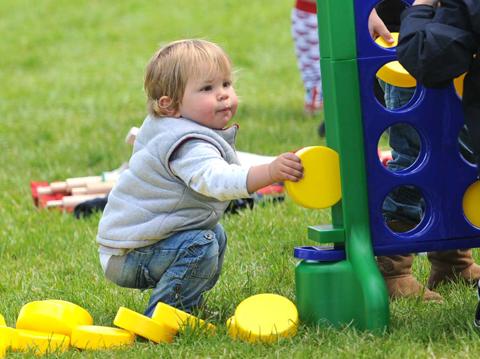 A youngster plays at the Malton and Norton jubilee party.
