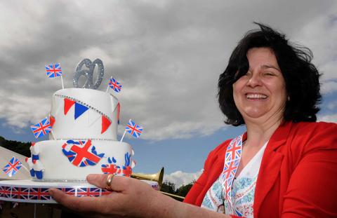 Di Keal pictured with a cake celebrating the Queens 60 years at Malton and Norton jubilee party.