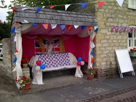Old Malton bus shelter decorated for the Jubilee street party alongside.