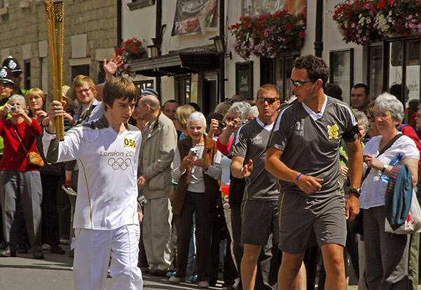 Max Strachen from Durham carries the Olympic torch from Pickering Railway station